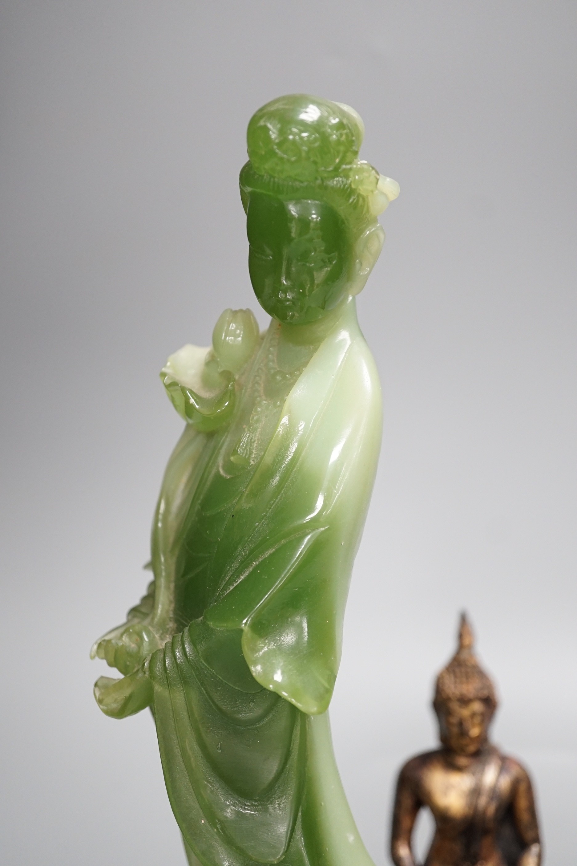 A Thai gilt resin model of Buddha, an Indian bronze model of Ganesh, a jadeite coloured carving of Guanyin and two other figures. Tallest 30cm